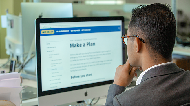 An office worker filling in the make a plan form online